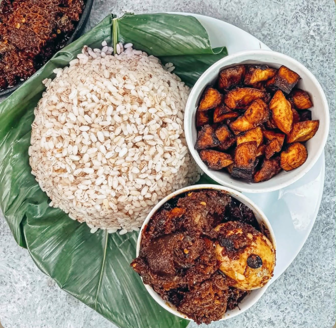 Ofada Rice & assorted meat sauce